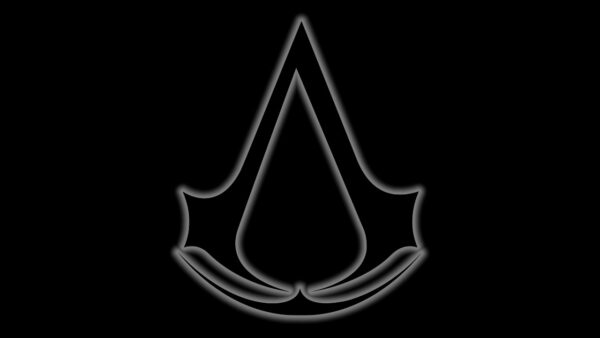 Imagem mostra o logotipo do jogo Assassin's Creed, com fundo preto e um brilho externo ao redor da marca