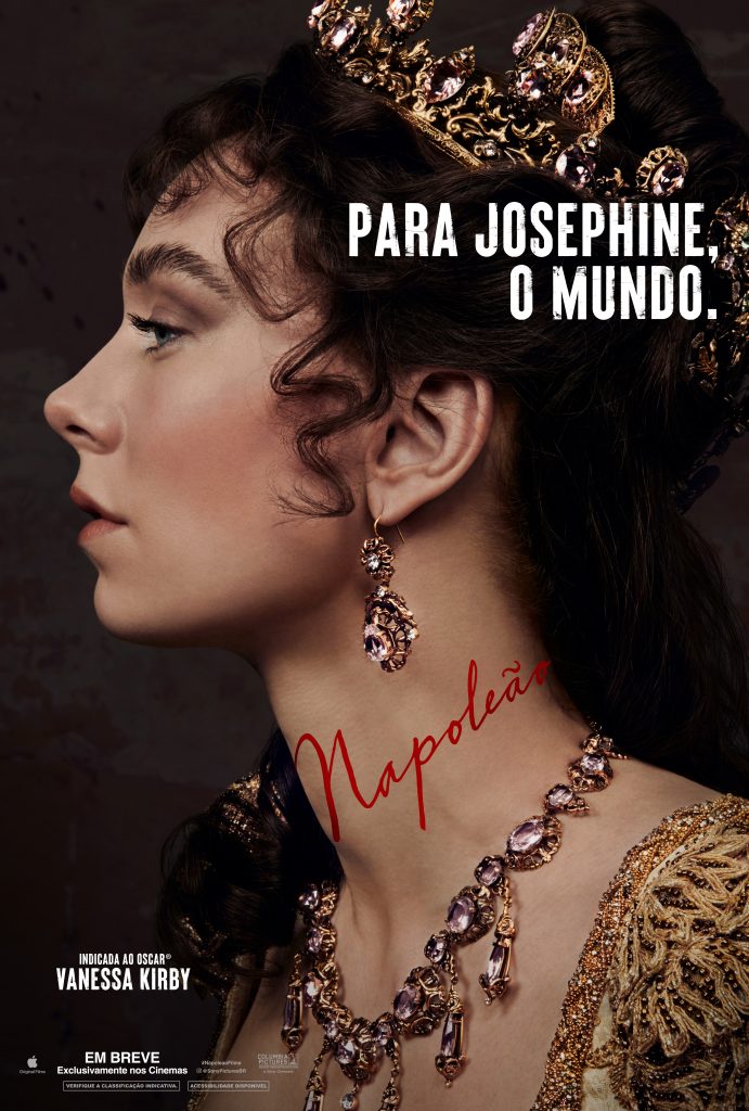 Pôster de divulgação do filme Napoleão, com a atriz Vanessa Kirby na capa; foto mostra o rosto da atriz de perfil, e ela com os cabelos longos e encaracolados, com uma coroa na cabeça, ao lado é possível ler "Para Josephine, o mundo", se referindo ao papel que Kirby irá desempenhar non longa